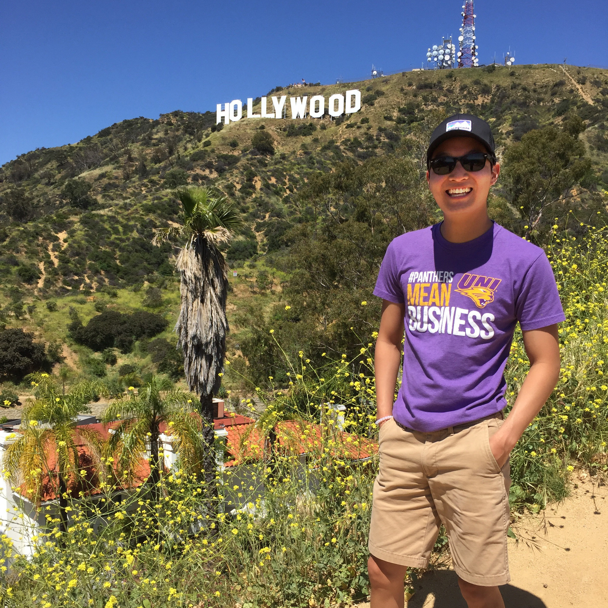 Smiling UNI student standing in front of the Hollywood sign